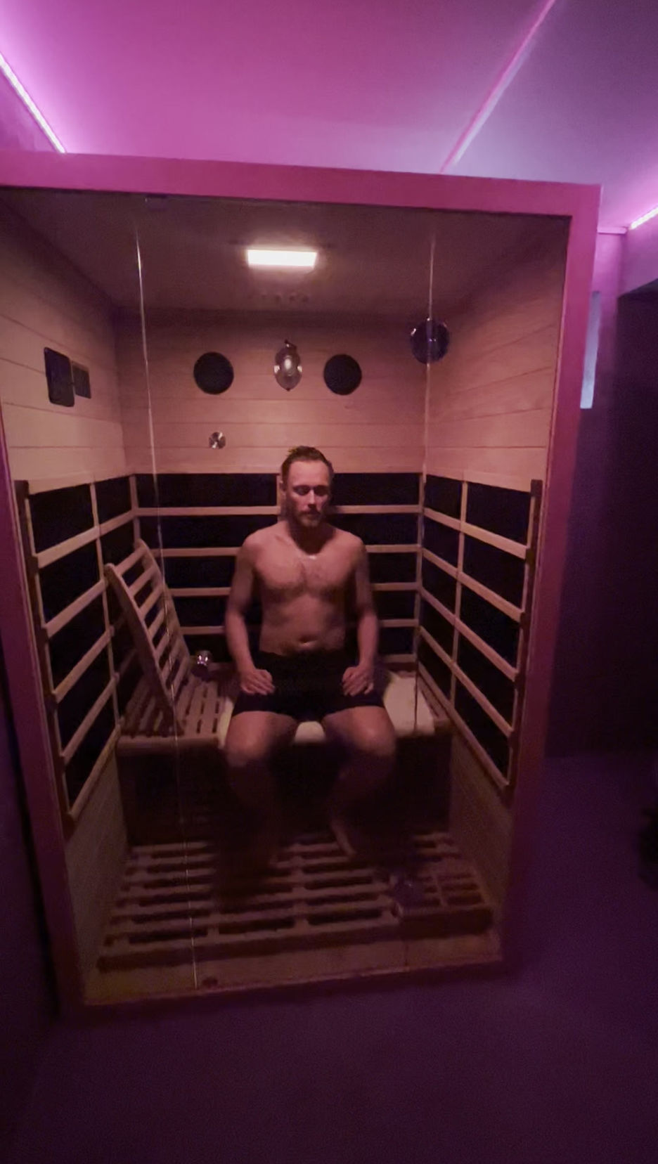 Wooden infrared sauna bench in warm light